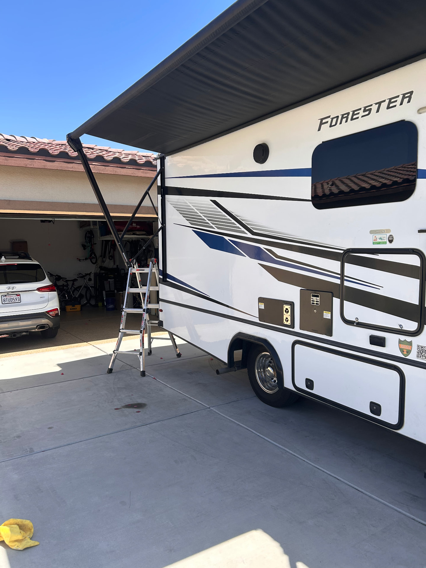 Forester motorhome with awning extended during service