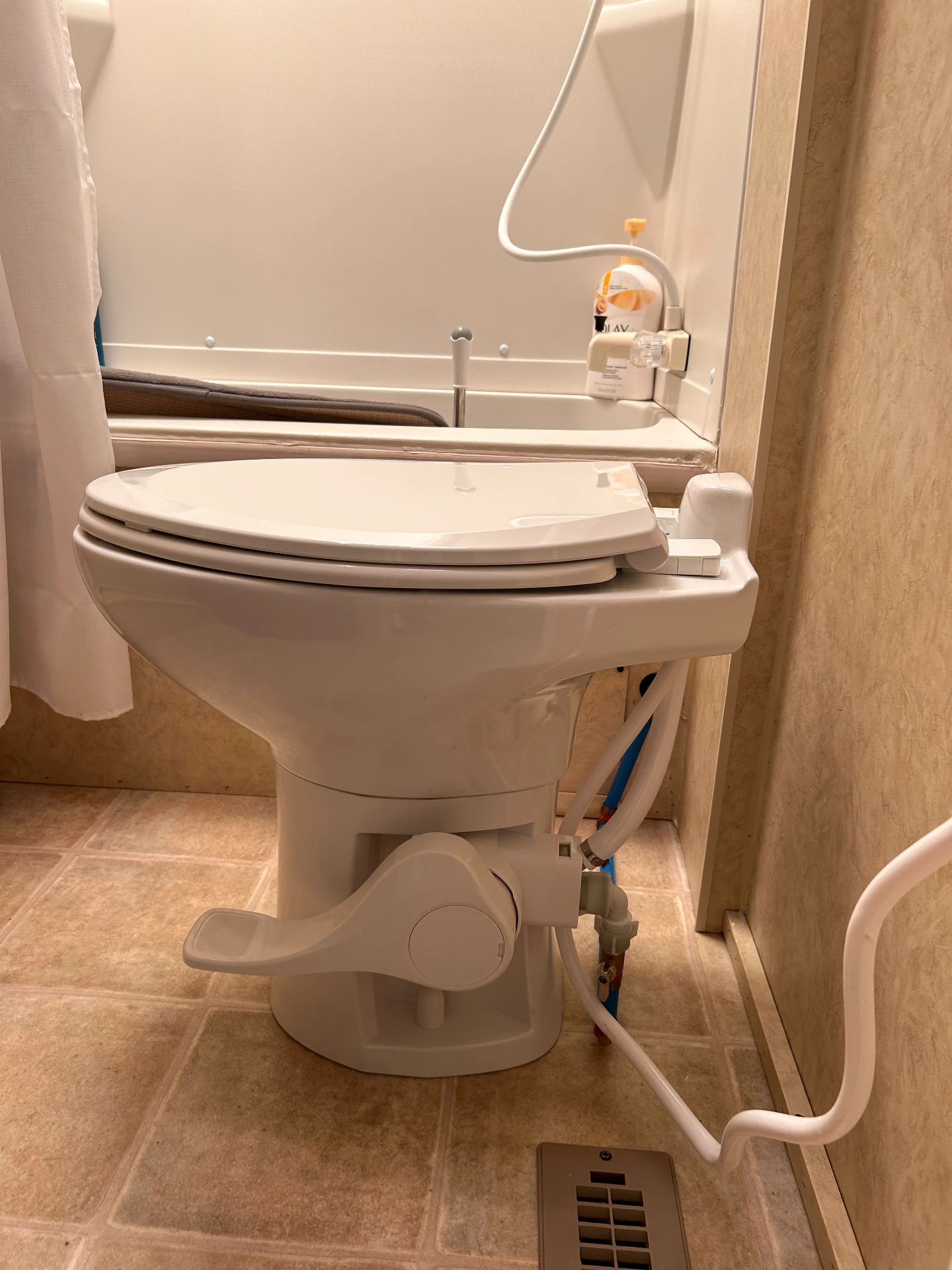 RV toilet and plumbing in the bathroom