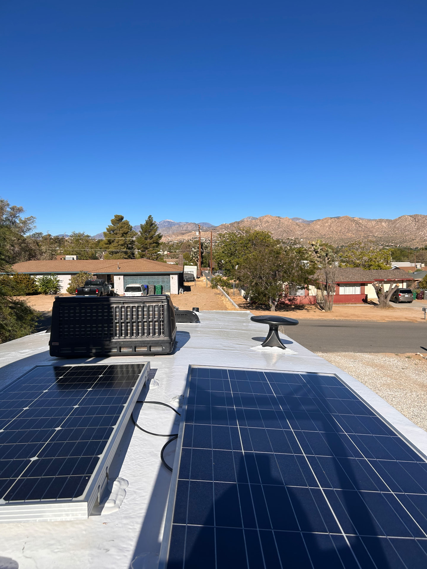 Freshly coated white RV roof under desert sun