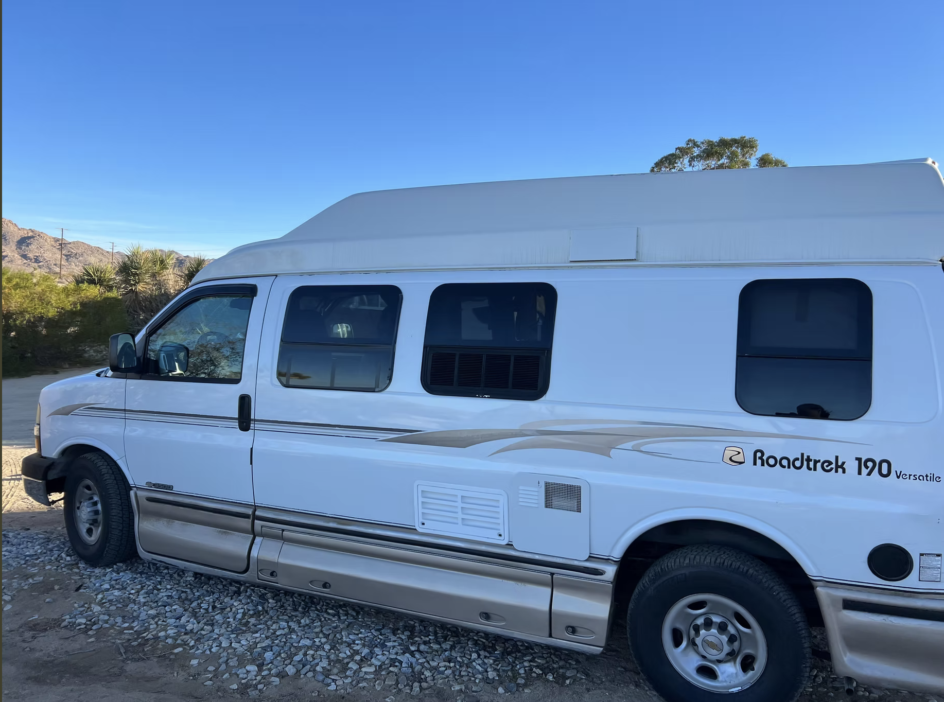 Class B camper van serviced on site in the high desert